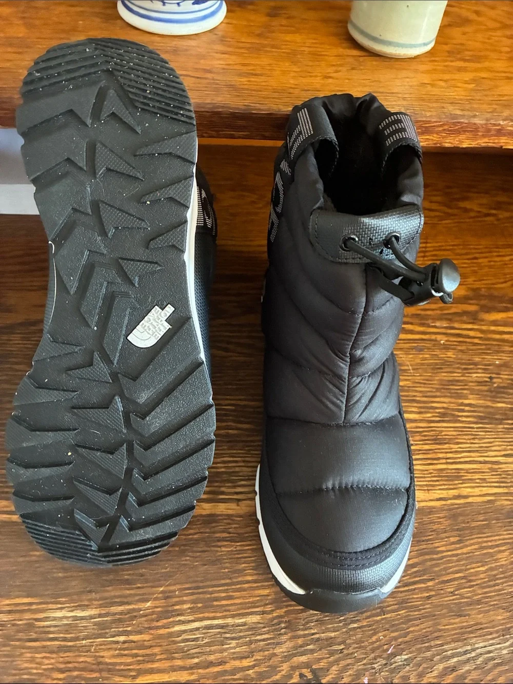 The North Face Kids Black Puffer Snow Boot with Light Gray Sole